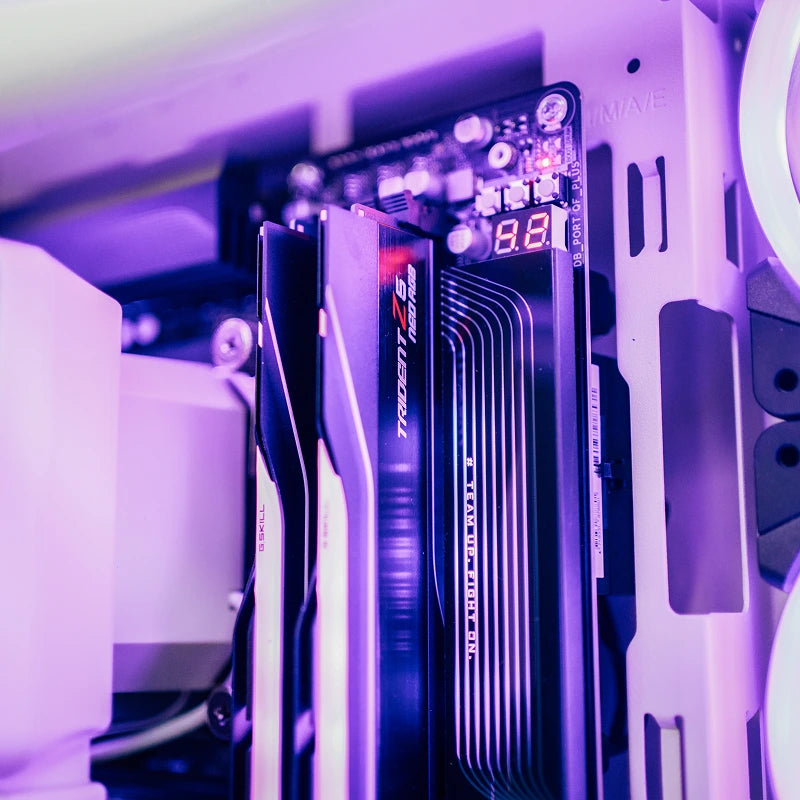 Close-up of RGB memory sticks inside the PC under purple light